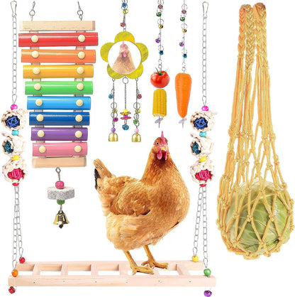 Assorted chicken toys including a xylophone, hanging beads, and a net bag on a white background.